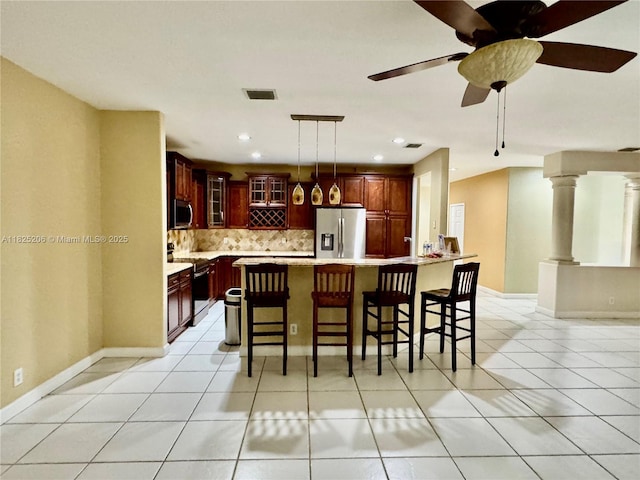 1379 NW 166th Ave, Pembroke Pines, FL 33028 - kitchen with appliances with stainless steel finishes, tasteful backsplash, light tile patterned flooring, light countertops, and recessed lighting