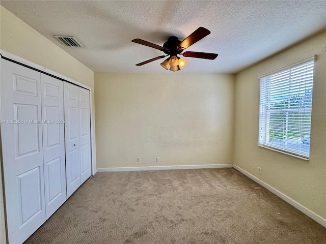 1379 NW 166th Ave, Pembroke Pines, FL 33028 - unfurnished bedroom featuring carpet flooring, a closet, a textured ceiling, and a ceiling fan