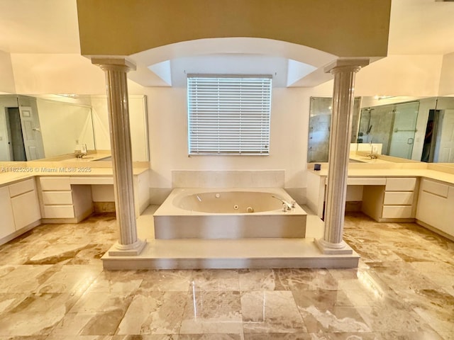 1379 NW 166th Ave, Pembroke Pines, FL 33028 - bathroom with ornate columns, a jetted tub, vanity, and stone finish flooring