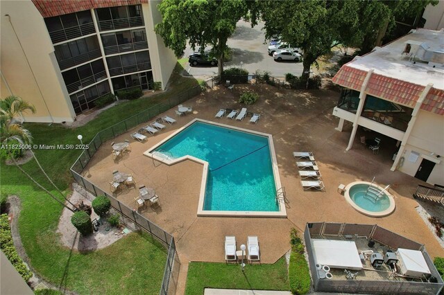 6555 W Broward Blvd Unit 208, Plantation, FL 33317 - community pool with a patio area