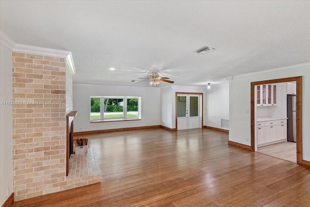 1550 NW 114th Ave, Plantation, FL 33323 - unfurnished living room with ornamental molding, a ceiling fan, light wood finished floors, and french doors