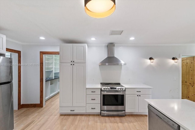 1550 NW 114th Ave, Plantation, FL 33323 - kitchen with stainless steel appliances, wall chimney range hood, white cabinetry, ornamental molding, and light countertops