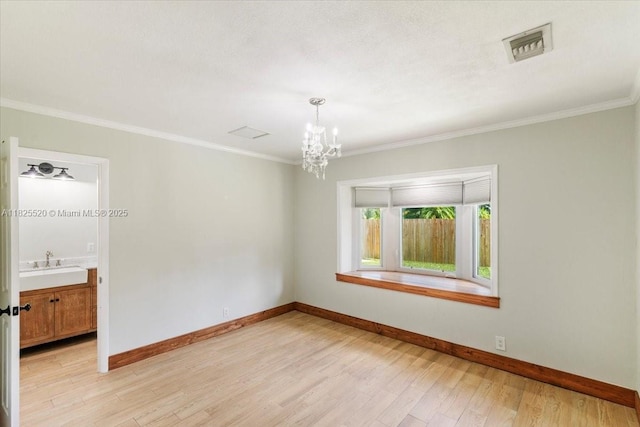 1550 NW 114th Ave, Plantation, FL 33323 - spare room featuring a chandelier, ornamental molding, and light wood-style flooring