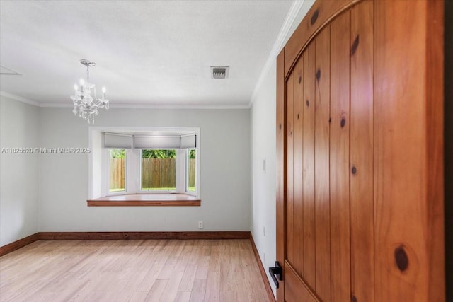1550 NW 114th Ave, Plantation, FL 33323 - spare room featuring ornamental molding, light wood-type flooring, and a chandelier