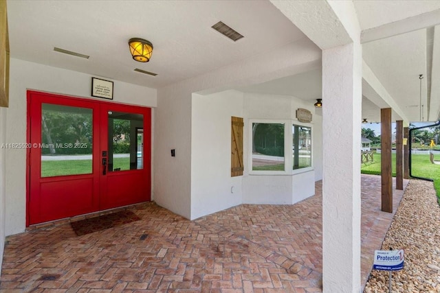 1550 NW 114th Ave, Plantation, FL 33323 - property entrance featuring stucco siding and french doors