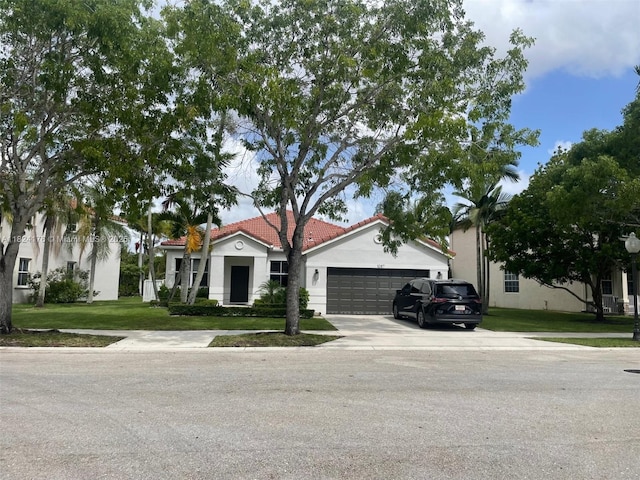 1087 Chenille Cir, Weston, FL 33327 - mediterranean / spanish home with a garage, concrete driveway, a tiled roof, a front yard, and stucco siding