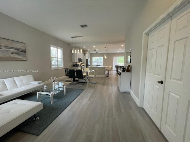 1087 Chenille Cir, Weston, FL 33327 - living room with light wood-style flooring, plenty of natural light, and recessed lighting