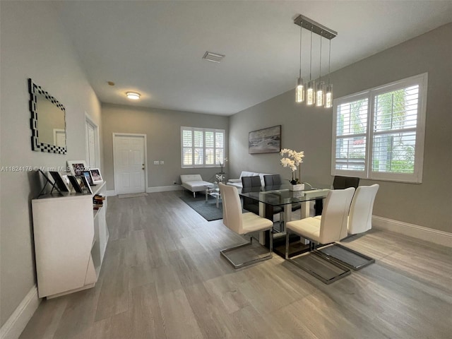 1087 Chenille Cir, Weston, FL 33327 - dining room with baseboards and light wood-style floors
