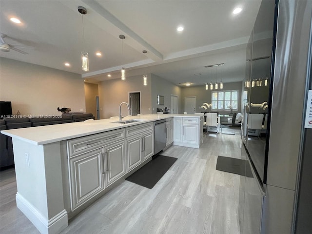 1087 Chenille Cir, Weston, FL 33327 - kitchen with appliances with stainless steel finishes, open floor plan, light wood-style flooring, light countertops, and recessed lighting