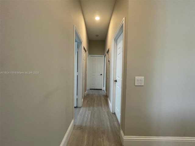 1087 Chenille Cir, Weston, FL 33327 - hallway featuring baseboards and wood finished floors