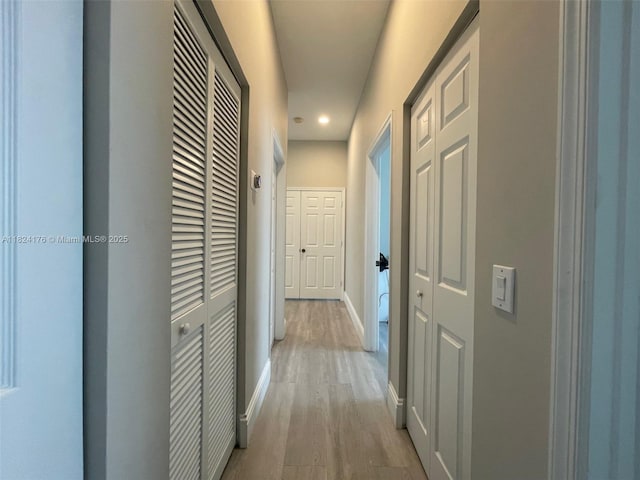 1087 Chenille Cir, Weston, FL 33327 - hallway with light wood-style floors and recessed lighting