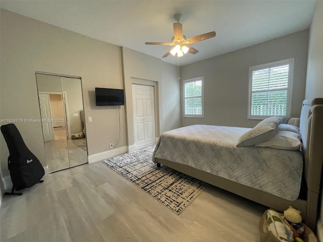 1087 Chenille Cir, Weston, FL 33327 - bedroom featuring light wood finished floors, a ceiling fan, and a closet