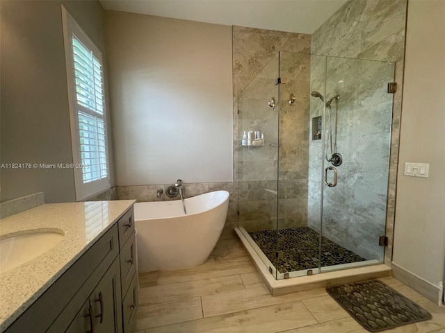 1087 Chenille Cir, Weston, FL 33327 - full bath with a soaking tub, plenty of natural light, a shower stall, and vanity