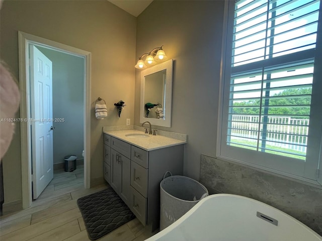 1087 Chenille Cir, Weston, FL 33327 - full bathroom featuring a freestanding bath and vanity