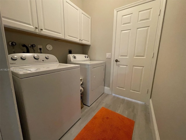 1087 Chenille Cir, Weston, FL 33327 - washroom featuring washer and clothes dryer, cabinet space, and light wood-style flooring