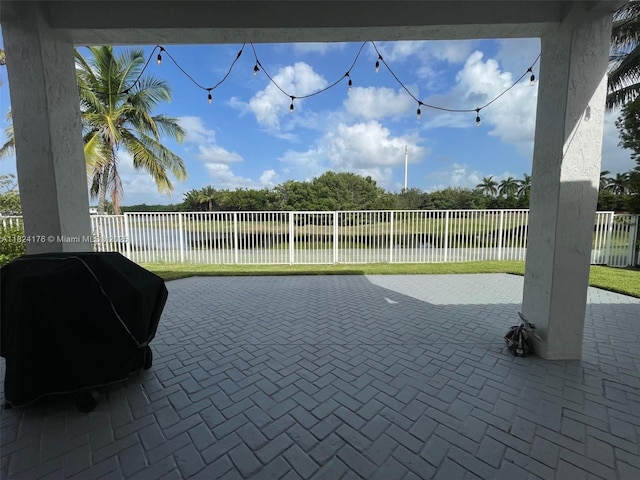 1087 Chenille Cir, Weston, FL 33327 - fenced backyard featuring a water view, a patio area, and area for grilling