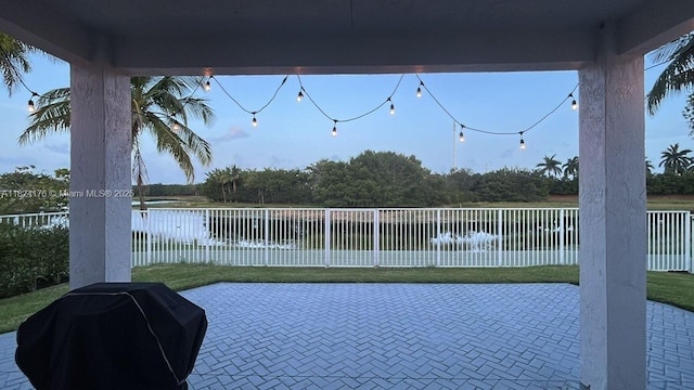 1087 Chenille Cir, Weston, FL 33327 - fenced backyard featuring a grill, a patio area, and a water view