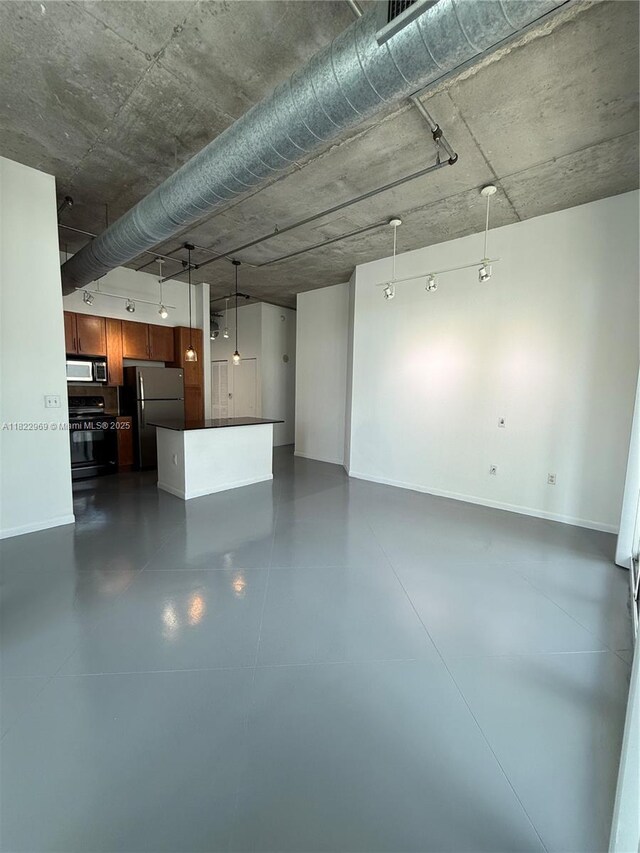2001 Biscayne Blvd Unit 2402, Miami, FL 33137 - unfurnished living room with baseboards and finished concrete floors