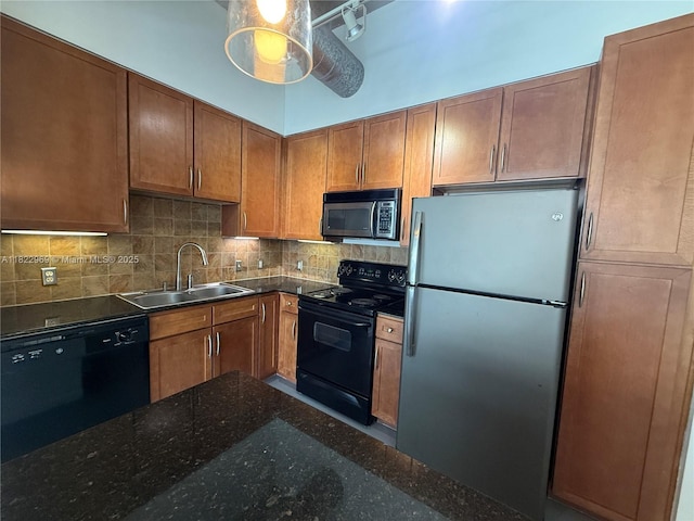 2001 Biscayne Blvd Unit 2402, Miami, FL 33137 - kitchen featuring black appliances, decorative backsplash, dark stone countertops, brown cabinetry, and ceiling fan