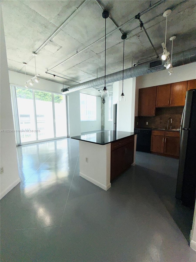 2001 Biscayne Blvd Unit 2402, Miami, FL 33137 - kitchen with freestanding refrigerator, dark countertops, open floor plan, and a center island