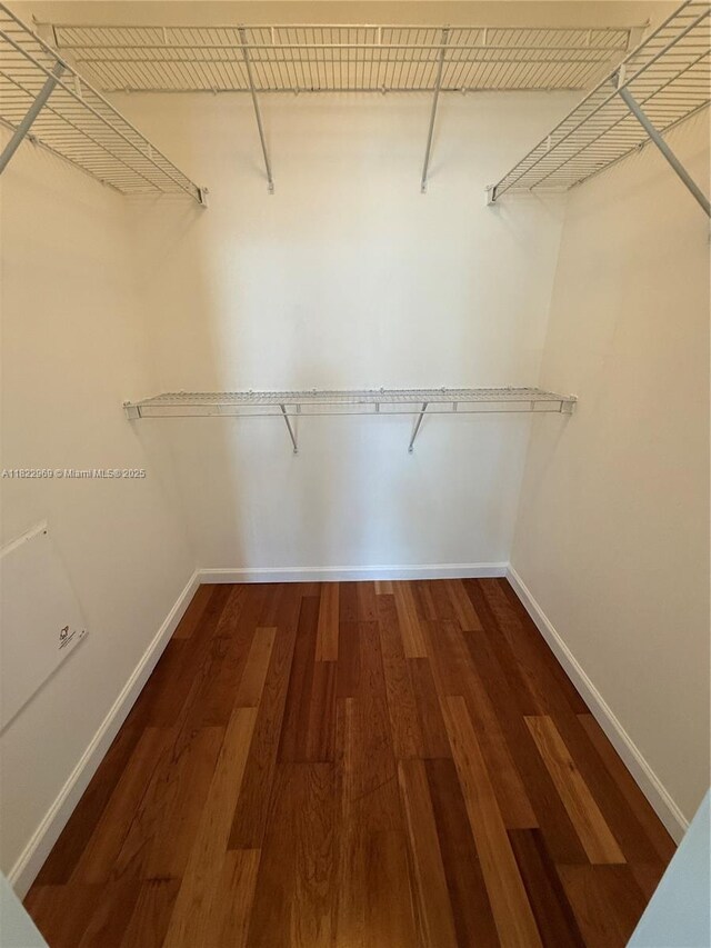 2001 Biscayne Blvd Unit 2402, Miami, FL 33137 - spacious closet featuring dark wood-type flooring