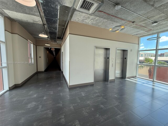 2001 Biscayne Blvd Unit 2402, Miami, FL 33137 - spare room featuring elevator, a wall of windows, and a smoke detector