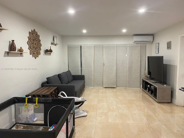 19001 NE 14th Ave Unit 325, Miami, FL 33179 - living area with a wall unit AC, recessed lighting, and light tile patterned floors
