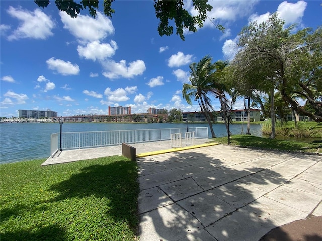 19001 NE 14th Ave Unit 325, Miami, FL 33179 - view of pool featuring a water view and a yard