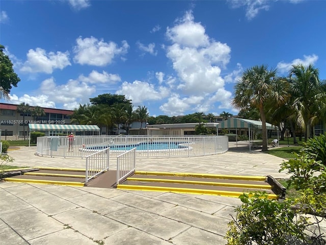 19001 NE 14th Ave Unit 325, Miami, FL 33179 - community pool featuring a patio