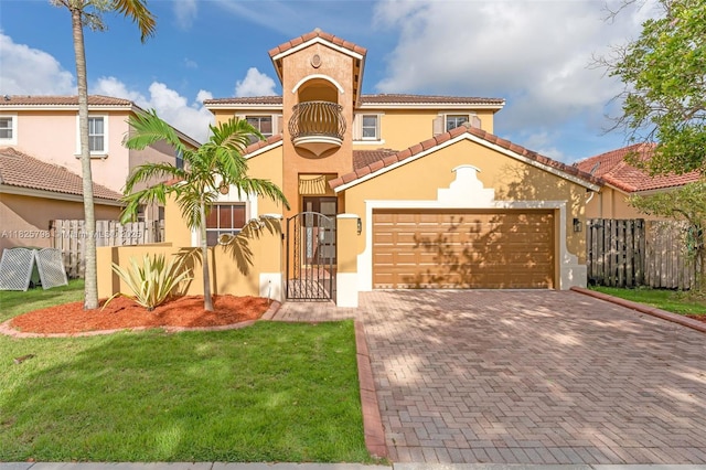 452 NE 20th Ter, Homestead, FL 33033 - mediterranean / spanish-style house with stucco siding, decorative driveway, a garage, a tiled roof, and a gate