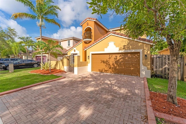 452 NE 20th Ter, Homestead, FL 33033 - mediterranean / spanish-style home with stucco siding, a garage, decorative driveway, and a tiled roof