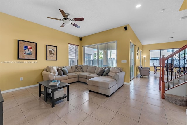 452 NE 20th Ter, Homestead, FL 33033 - living room featuring a ceiling fan, plenty of natural light, stairs, light tile patterned flooring, and recessed lighting