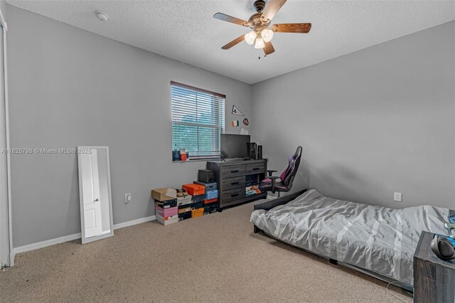 452 NE 20th Ter, Homestead, FL 33033 - bedroom featuring carpet flooring, a ceiling fan, and a textured ceiling