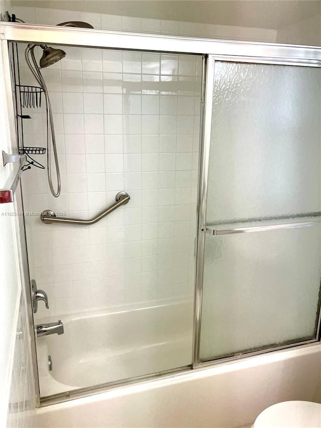 9041 Sunrise Lakes Blvd Unit 208, Sunrise, FL 33322 - full bath featuring shower / bath combination with glass door and toilet