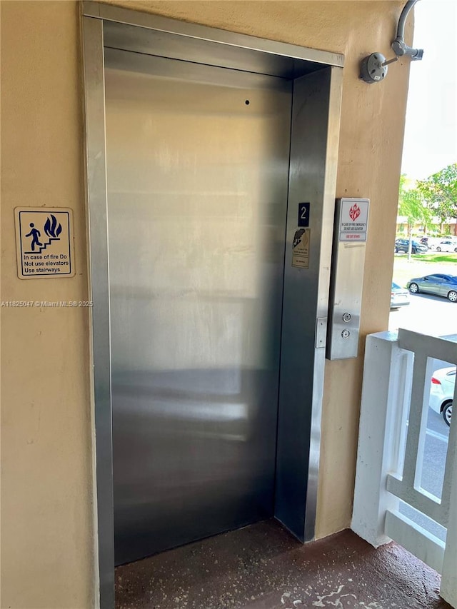 9041 Sunrise Lakes Blvd Unit 208, Sunrise, FL 33322 - elevator featuring stucco siding