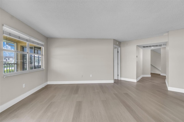 2246 SE 27th Dr Unit 204-D, Homestead, FL 33035 - unfurnished room featuring wood finished floors and a textured ceiling