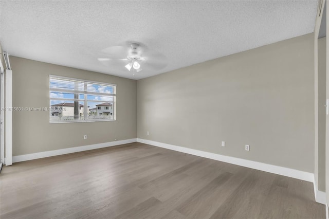 2246 SE 27th Dr Unit 204-D, Homestead, FL 33035 - unfurnished room featuring a textured ceiling, ceiling fan, and wood finished floors