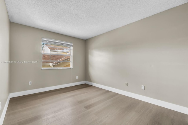 2246 SE 27th Dr Unit 204-D, Homestead, FL 33035 - spare room featuring wood finished floors and a textured ceiling