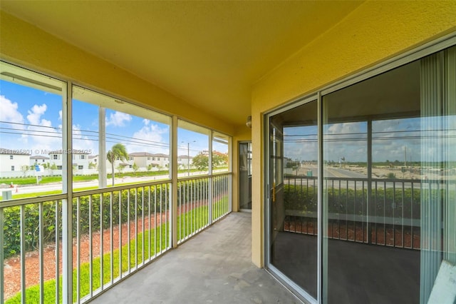2246 SE 27th Dr Unit 204-D, Homestead, FL 33035 - unfurnished sunroom featuring a residential view