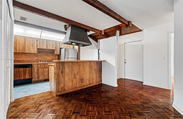 616 Briarwood Cir Unit 1-44, Hollywood, FL 33024 - kitchen featuring freestanding refrigerator, dishwasher, a peninsula, beam ceiling, and brown cabinetry