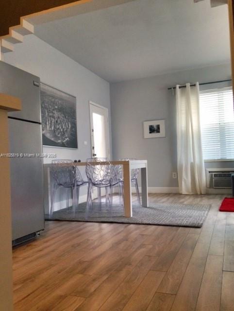 1325 Meridian Ave Unit 6, Miami Beach, FL 33139 - unfurnished living room featuring hardwood / wood-style floors and a wall mounted air conditioner