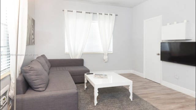 1325 Meridian Ave Unit 6, Miami Beach, FL 33139 - living room with light wood finished floors and baseboards