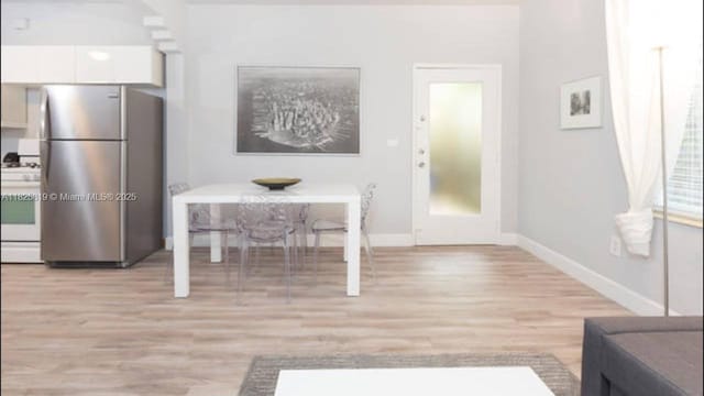 1325 Meridian Ave Unit 6, Miami Beach, FL 33139 - living area featuring light wood-style flooring and baseboards
