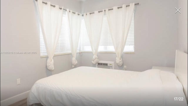 1325 Meridian Ave Unit 6, Miami Beach, FL 33139 - bedroom with a wall unit AC and baseboards