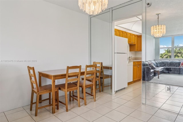 900 Saint Charles Pl Unit 420, Pembroke Pines, FL 33026 - dining room featuring a chandelier and light tile patterned floors