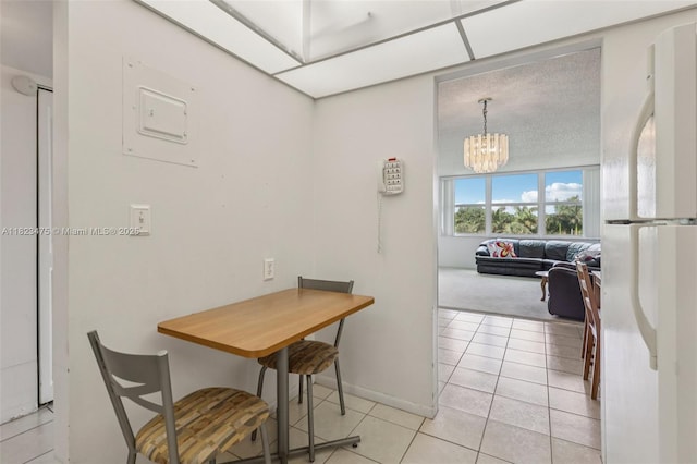 900 Saint Charles Pl Unit 420, Pembroke Pines, FL 33026 - dining space with a chandelier, light tile patterned floors, light colored carpet, and electric panel