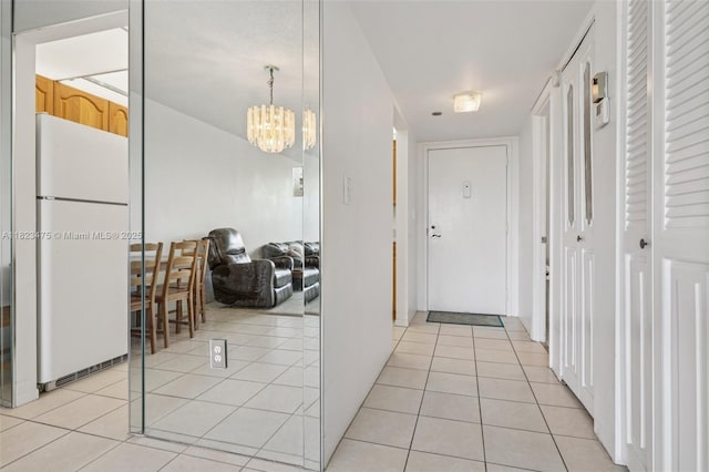900 Saint Charles Pl Unit 420, Pembroke Pines, FL 33026 - hall featuring light tile patterned floors and a chandelier