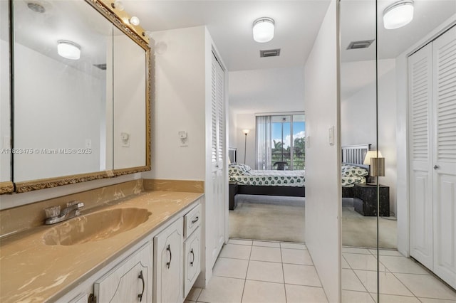 900 Saint Charles Pl Unit 420, Pembroke Pines, FL 33026 - bathroom featuring a closet, connected bathroom, vanity, and tile patterned floors