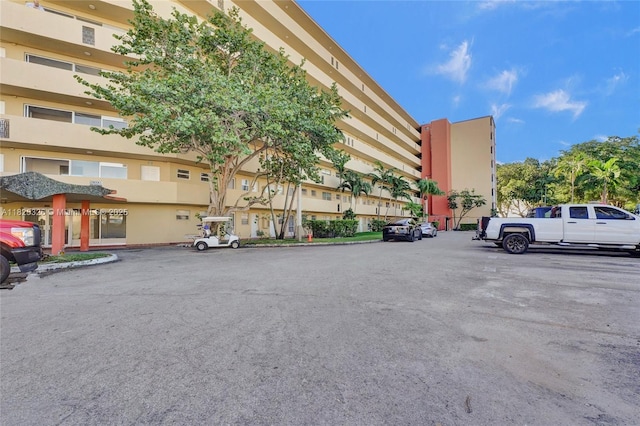 1750 NE 191st St Unit 106-1, Miami, FL 33179 - view of property featuring uncovered parking