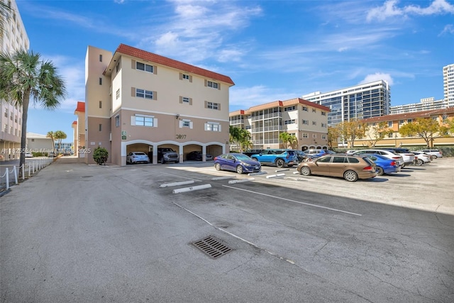 2097 S Ocean Unit 207, Hallandale Beach, FL 33009 - view of apartment building / complex with uncovered parking